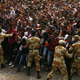 Demonstrators chant slogans while flashing the Oromo protest gesture during Irreecha, the thanksgiving festival of the Oromo people, in Bishoftu town, Oromia region, Ethiopia, October 2, 2016.